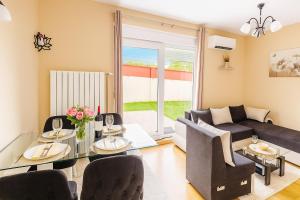 a living room with a couch and a table at Apartman Bella vita 2 in Zlatibor