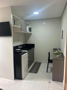 Kuchyň nebo kuchyňský kout v ubytování Mini Apto Pertinho de Tudo - Sem vaga de garagem + 1 fotografie