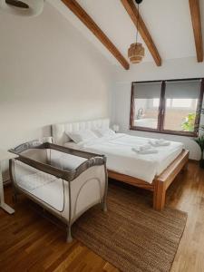 Postel nebo postele na pokoji v ubytování Ikigai Penthouse Apartment + 27 fotografií