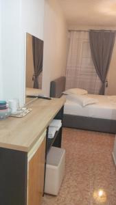 Postel nebo postele na pokoji v ubytování Areti Rooms Hotel