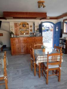 a kitchen with a table and chairs in a room at Panorama Hotel in Kalymnos +34 photos