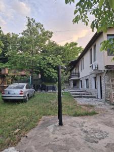 a car parked in front of a house at The Byala Escape, Private Villa with Bar & Hot Tub in Byala