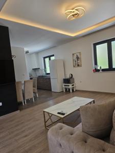 a living room with a couch and a table at Apartments Villa Joja in Međugorje