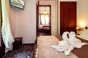 Postel nebo postele na pokoji v ubytování Guesthouse To kalivi