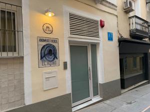a building with a washing machine sign on the side of it at Apartamentos "El Aljibe" - Parking incluido in Badajoz +95 photos