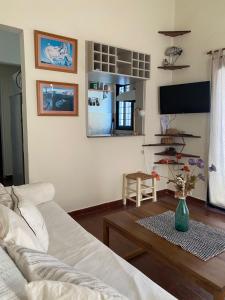 a living room with a couch and a table at Buen Descanso I in San Pedro