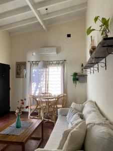 a living room with a couch and a table at Buen Descanso I in San Pedro