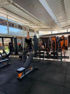 a gym with treadmills and machines in a building at Apartamento Verde in Avaré