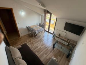 TV a/nebo společenská místnost v ubytování Apartman MIG
