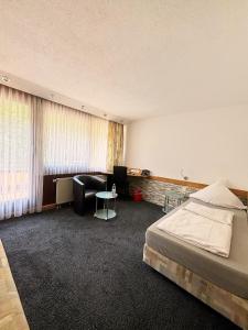 Postel nebo postele na pokoji v ubytování Hotel Wasserfall
