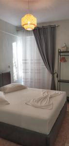 Postel nebo postele na pokoji v ubytování Areti Rooms Hotel