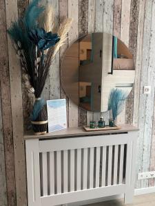 a dressing table with a mirror on a wall at Lit 2 en 1ère Classe-Orly-T7-RER C&D in Athis-Mons
