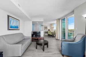 a living room with a couch and a table at 2 King Beds & Ocean Views! Oceans One 601 in Myrtle Beach
