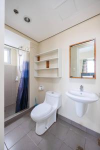 a bathroom with a toilet and a sink at 2-Bedroom Retreat in Avida Riala Prime Location in Cebu City
