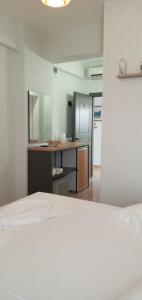 Kuchyň nebo kuchyňský kout v ubytování Areti Rooms Hotel