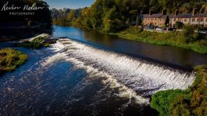 an aerial view of a river with waterfalls at 3 bed house in Lucan