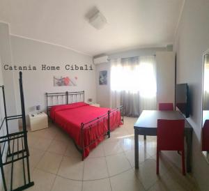 Posteľ alebo postele v izbe v ubytovaní Catania Home Cibali