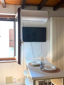 a kitchen with a table with two plates on it at La Chiocciola in Parma