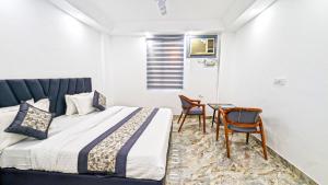 Postel nebo postele na pokoji v ubytování HOTEL GREEN VEGAS