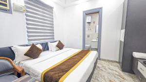Postel nebo postele na pokoji v ubytování HOTEL GREEN VEGAS