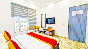 TV a/nebo společenská místnost v ubytování HOTEL GREEN VEGAS