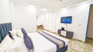 Postel nebo postele na pokoji v ubytování HOTEL GREEN VEGAS