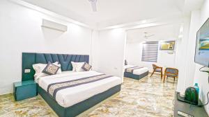 Postel nebo postele na pokoji v ubytování HOTEL GREEN VEGAS