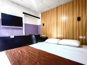 Postelja oz. postelje v sobi nastanitve Ivy Hotel Awolowo