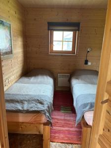 Postel nebo postele na pokoji v ubytování Kuningatalu camping