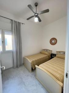 Ένα ή περισσότερα κρεβάτια σε δωμάτιο στο LA ROSA DEI VENTI apartment