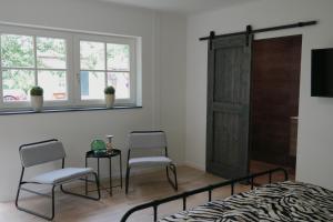 Μια τηλεόραση ή/και κέντρο ψυχαγωγίας στο Boerderij Lodge De Haarakker