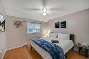 a bedroom with a bed and a ceiling fan at Pocono Chalet Towamensing with Hot Tub Lake and Pool in Albrightsville