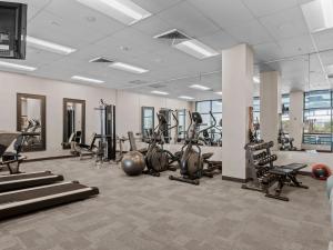 a gym with several treadmills and exercise bikes at Newpark by All Seasons Resort Lodging in Park City