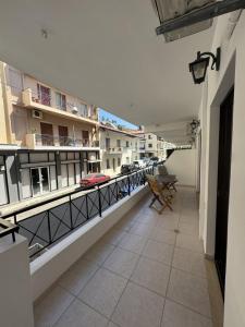 a balcony of a building with a view of a street at Eleni's Apartment in Nafpaktos
