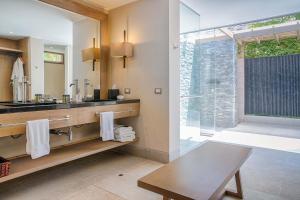 a bathroom with a sink and a mirror at Arennas Mancora in Máncora