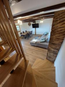 a living room with a couch and a table at Bakina kuća in Jasetići