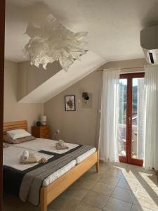 Postel nebo postele na pokoji v ubytování Agava Apartments + 2 fotografie