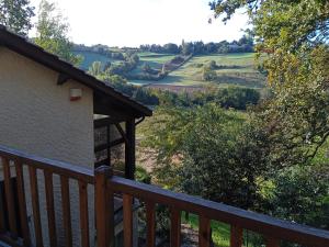 a view from the deck of a house with a view of a field at Cours ruralité tranquillité in Cours