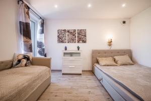 Postel nebo postele na pokoji v ubytování Wellness Villa Klínovec Views