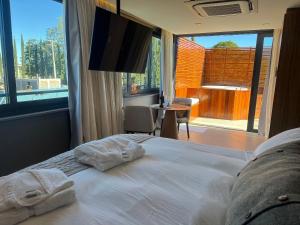 Katil atau katil-katil dalam bilik di Apartamento com Ofurô Vale dos Vinhedos