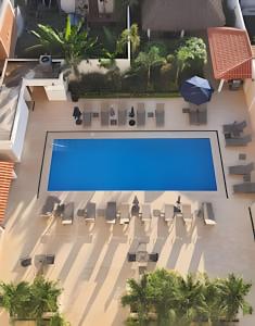 an overhead view of a pool in a building at Costa Paraíso D-10 Estudio in Bucerías