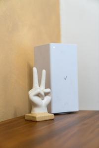 a statue of a hand with the peace sign at Modern Studio - Parking Available - 15 min NYC in Jersey City