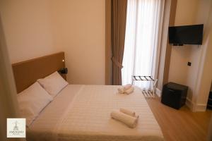 Postel nebo postele na pokoji v ubytování Amenano Relais Rooms