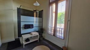 a bathroom with a sink and a mirror and a window at Le Manoir de la Belle Endormie in Valréas