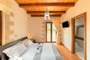 Postel nebo postele na pokoji v ubytování Cretan Dream Villa