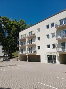 Budova, v ktorej sa apartmán nachádza + 4 fotografie