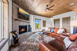 a living room with a couch and a fireplace at Premier Mountain Views By Avada Properties in Gatlinburg