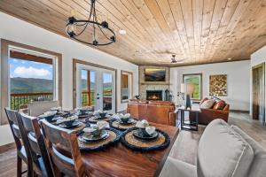 a dining room with a table and chairs at Premier Mountain Views By Avada Properties in Gatlinburg