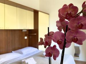 Een bed of bedden in een kamer bij Residence Carioca