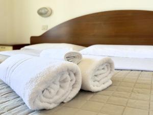 Een bed of bedden in een kamer bij Residence Carioca